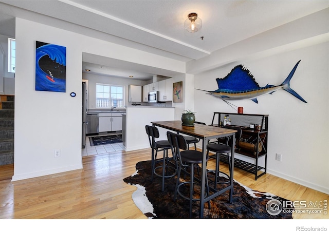 3970 Colorado Ave Unit G, Boulder, CO 80303 - dining space with light wood finished floors and stairs