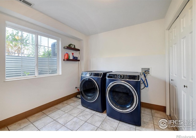 3970 Colorado Ave Unit G, Boulder, CO 80303 - laundry room with independent washer and dryer and light tile patterned flooring