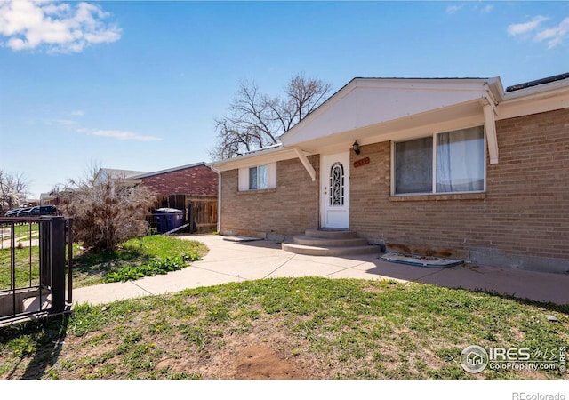 5519 Tucson St, Denver, CO 80239 - view of front of property with brick siding