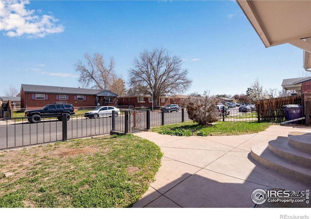 5519 Tucson St, Denver, CO 80239 - view of yard featuring a residential view and a gate