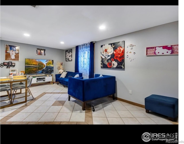 5519 Tucson St, Denver, CO 80239 - living area with recessed lighting and light tile patterned floors