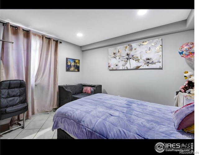 5519 Tucson St, Denver, CO 80239 - tiled bedroom with recessed lighting