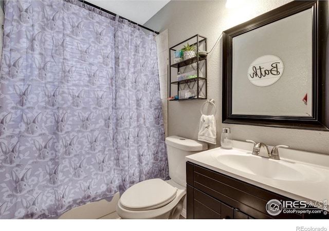 5519 Tucson St, Denver, CO 80239 - full bath featuring vanity, a textured wall, and a shower with curtain
