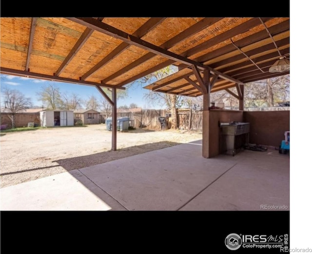 5519 Tucson St, Denver, CO 80239 - view of patio / terrace with a shed