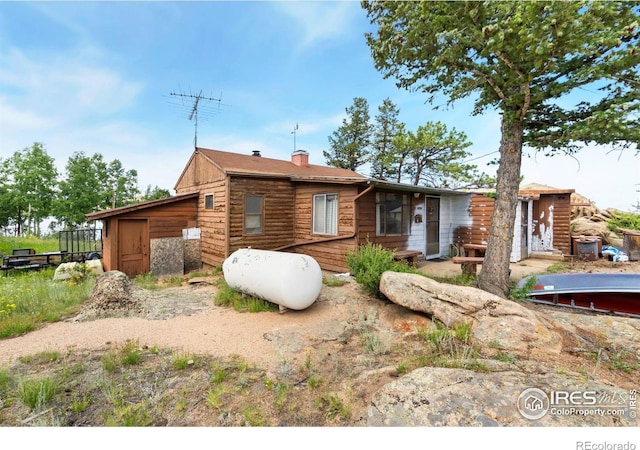 983 Ramona Dr, Red Feather Lakes, CO 80545 - view of front facade featuring a chimney