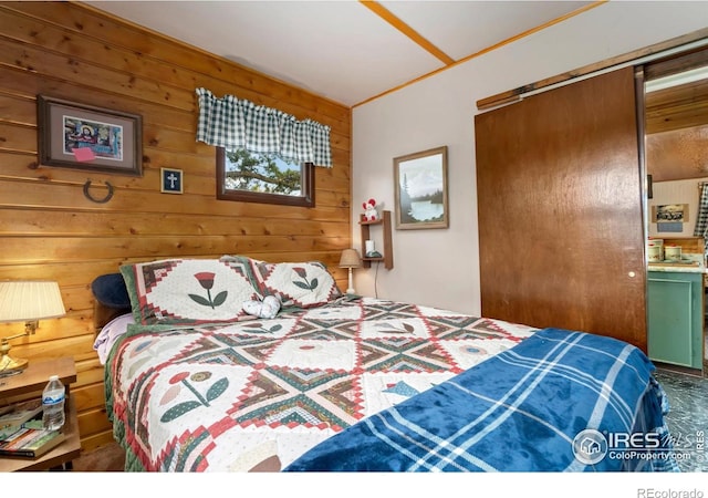 983 Ramona Dr, Red Feather Lakes, CO 80545 - bedroom with wood walls and a closet