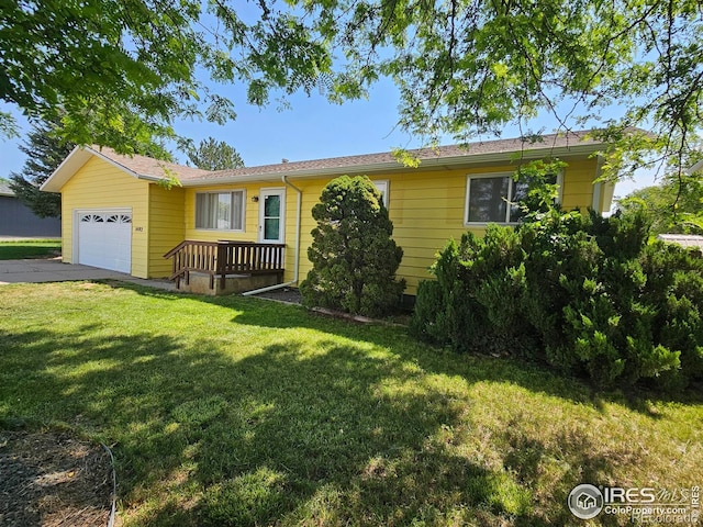 1402 Fillmore St, Sterling, CO 80751 - ranch-style home with an attached garage, a front lawn, and concrete driveway