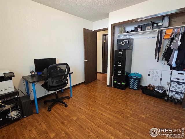1402 Fillmore St, Sterling, CO 80751 - office space with wood finished floors and a textured ceiling