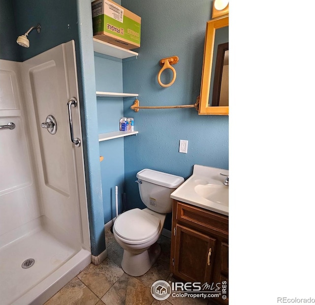 1402 Fillmore St, Sterling, CO 80751 - full bath with a shower stall, vanity, and tile patterned floors