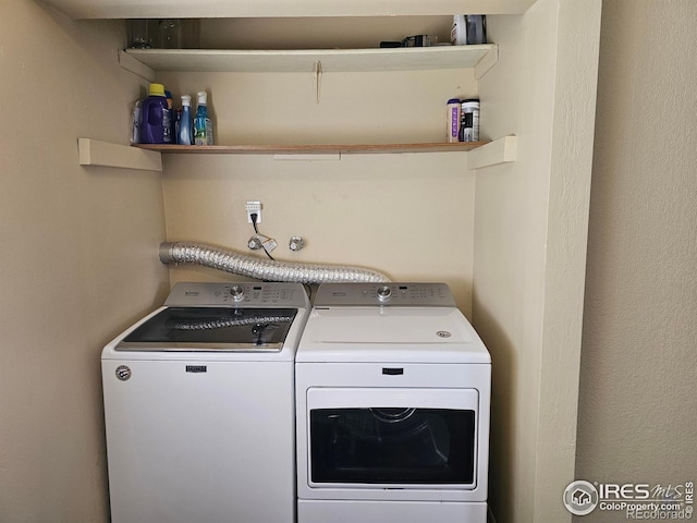 1402 Fillmore St, Sterling, CO 80751 - washroom featuring washing machine and clothes dryer