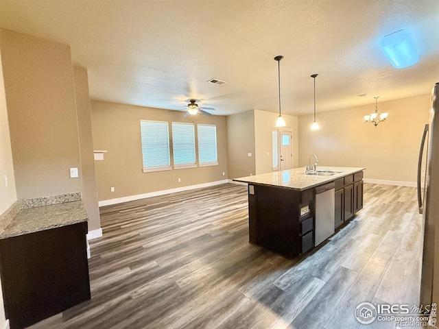 2110 Nancy Gray Ave, Fort Collins, CO 80525 - kitchen with stainless steel appliances, wood finished floors, a chandelier, ceiling fan, and open floor plan
