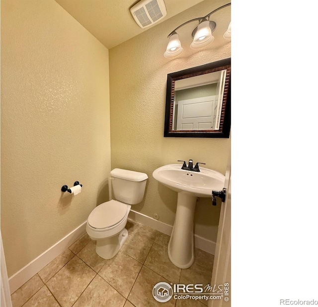 2110 Nancy Gray Ave, Fort Collins, CO 80525 - half bathroom with tile patterned flooring and a textured wall