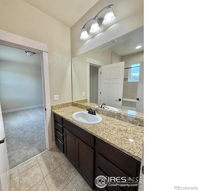 2110 Nancy Gray Ave, Fort Collins, CO 80525 - bathroom with vanity and tile patterned flooring