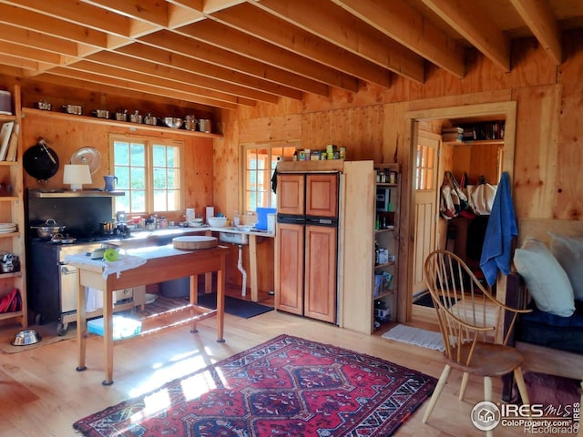1001 County Road 86, Red Feather Lakes, CO 80545 - home office featuring wooden walls, light wood-style floors, and beamed ceiling