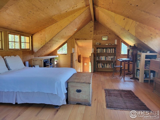 1001 County Road 86, Red Feather Lakes, CO 80545 - bedroom featuring wooden ceiling, hardwood / wood-style floors, multiple windows, and wood walls