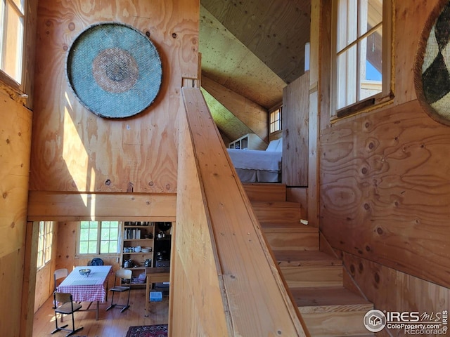 1001 County Road 86, Red Feather Lakes, CO 80545 - staircase with wood finished floors and wooden walls
