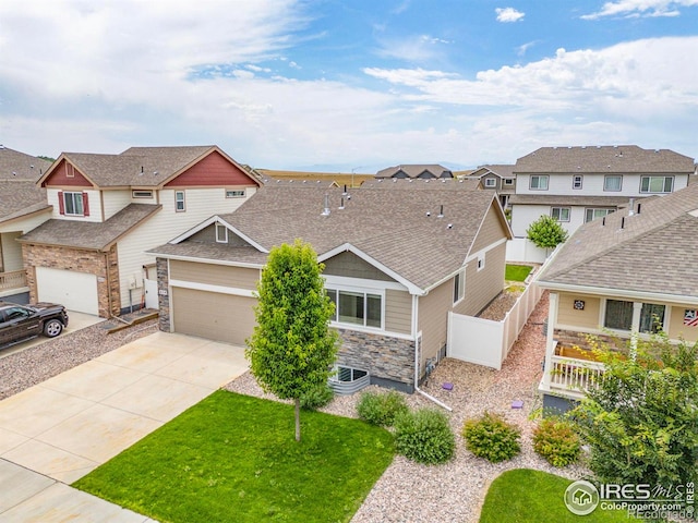 619 Rosedale St, Severance, CO 80550 - craftsman-style house featuring a residential view, driveway, stone siding, and a shingled roof