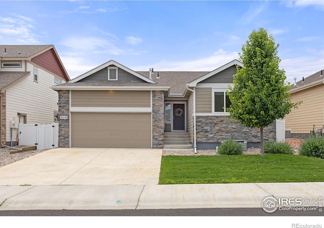 619 Rosedale St, Severance, CO 80550 - craftsman inspired home featuring stone siding, concrete driveway, an attached garage, entry steps, and roof with shingles