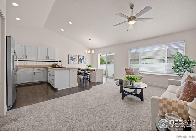 619 Rosedale St, Severance, CO 80550 - living area with vaulted ceiling, a chandelier, dark wood finished floors, a ceiling fan, and recessed lighting