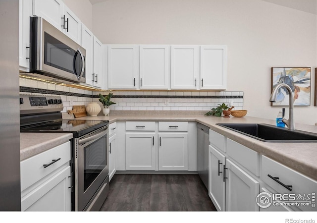 619 Rosedale St, Severance, CO 80550 - kitchen with stainless steel appliances, backsplash, and white cabinetry