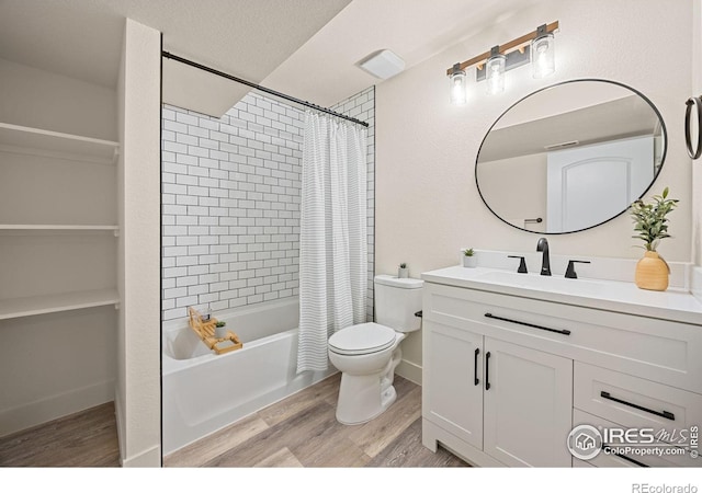 619 Rosedale St, Severance, CO 80550 - full bathroom featuring wood finished floors, vanity, and shower / tub combo with curtain