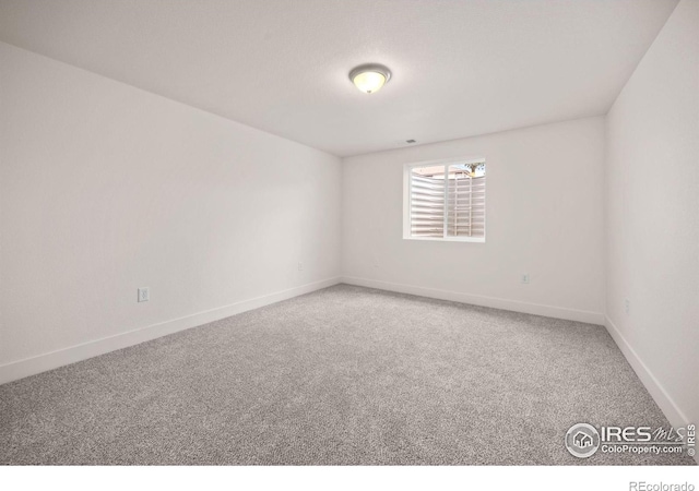 619 Rosedale St, Severance, CO 80550 - unfurnished room featuring carpet and baseboards