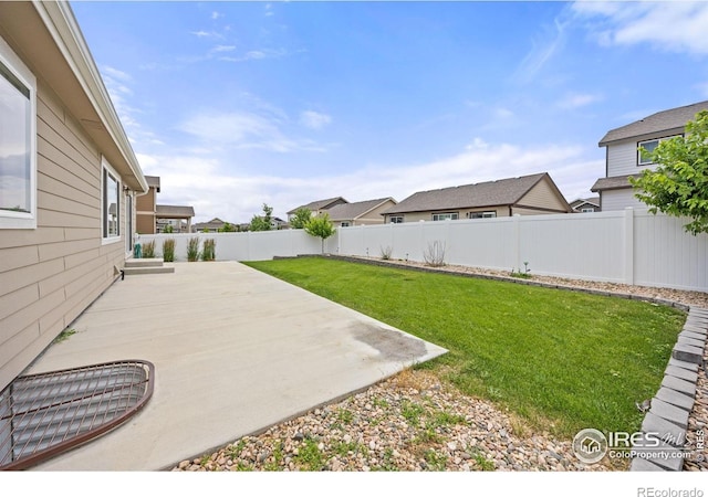 619 Rosedale St, Severance, CO 80550 - fenced backyard with a patio area and a residential view