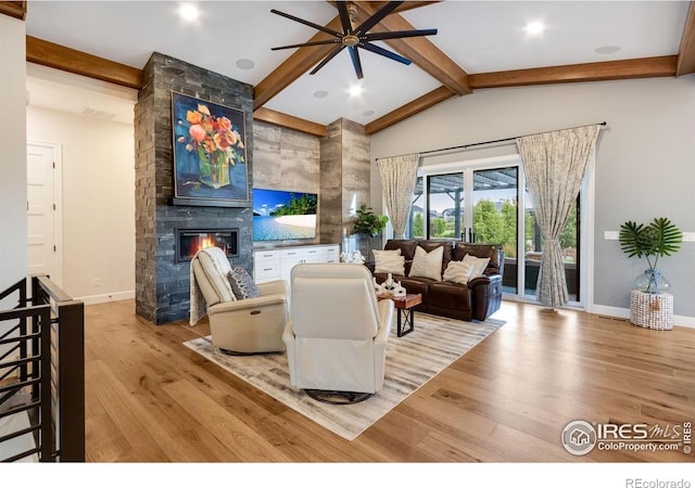 4198 Prestwich Ct, Timnath, CO 80547 - living area featuring a fireplace, ceiling fan, and wood finished floors
