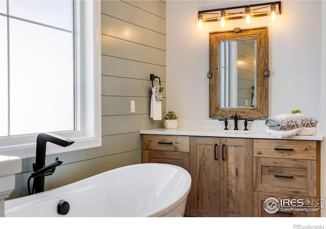 4198 Prestwich Ct, Timnath, CO 80547 - bathroom with a freestanding tub and vanity