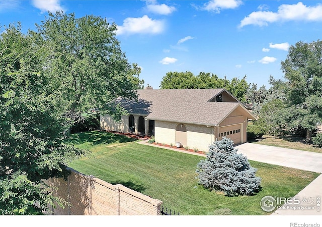 1470 71st Ave, Greeley, CO 80634 - view of front of property featuring concrete driveway, an attached garage, and a shingled roof