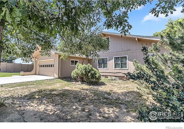 1470 71st Ave, Greeley, CO 80634 - view of front of property with an attached garage and concrete driveway
