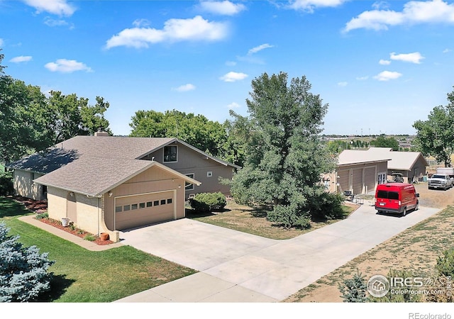 1470 71st Ave, Greeley, CO 80634 - view of front of house featuring driveway, a chimney, a front yard, an attached garage, and roof with shingles