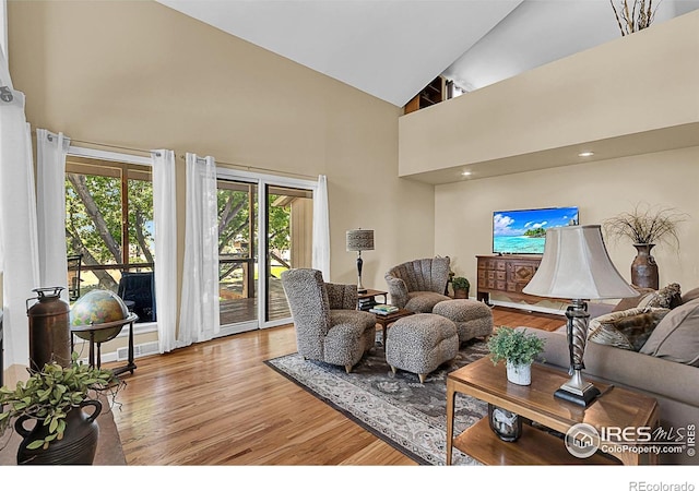 1470 71st Ave, Greeley, CO 80634 - living room with high vaulted ceiling and wood finished floors