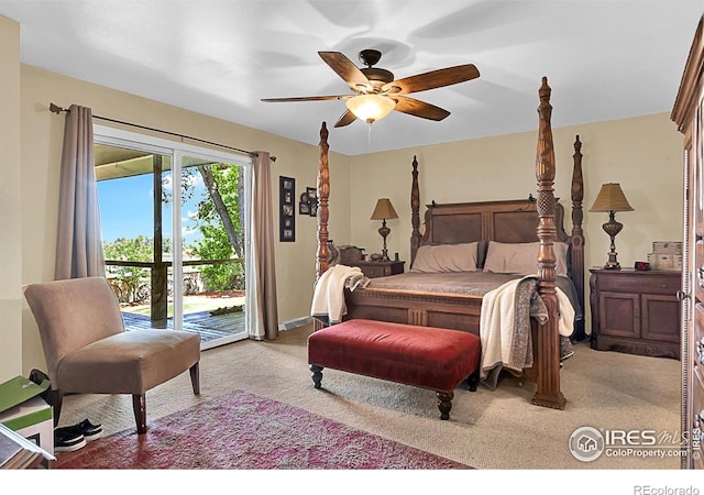 1470 71st Ave, Greeley, CO 80634 - bedroom with access to outside, light carpet, and a ceiling fan