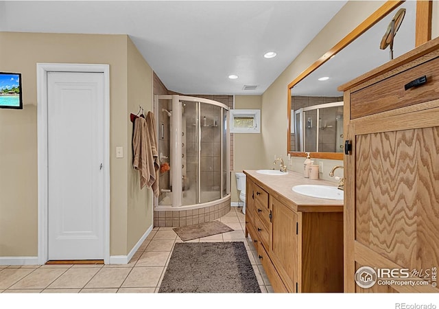 1470 71st Ave, Greeley, CO 80634 - full bathroom featuring tiled shower, tile patterned flooring, double vanity, and recessed lighting