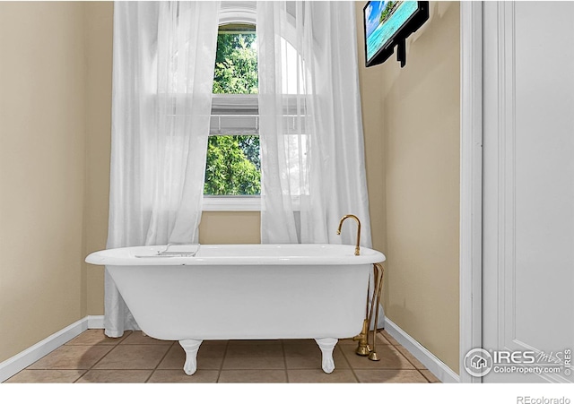 1470 71st Ave, Greeley, CO 80634 - bathroom with tile patterned floors and a freestanding tub