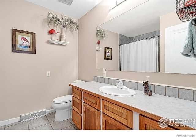1470 71st Ave, Greeley, CO 80634 - bathroom featuring tile patterned floors, vanity, and curtained shower