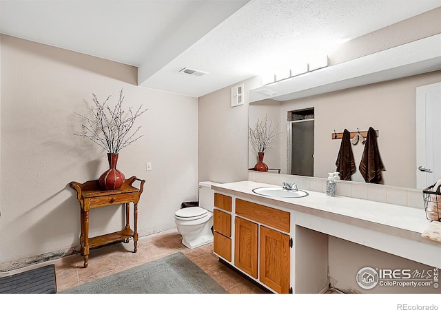 1470 71st Ave, Greeley, CO 80634 - full bathroom featuring vanity, an enclosed shower, and tile patterned floors