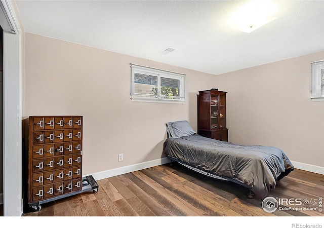 1470 71st Ave, Greeley, CO 80634 - bedroom with wood finished floors and baseboards