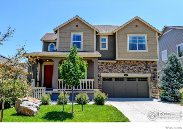 833 Carbonate Ln, Erie, CO 80516 - craftsman inspired home featuring covered porch, concrete driveway, stone siding, an attached garage, and a front lawn