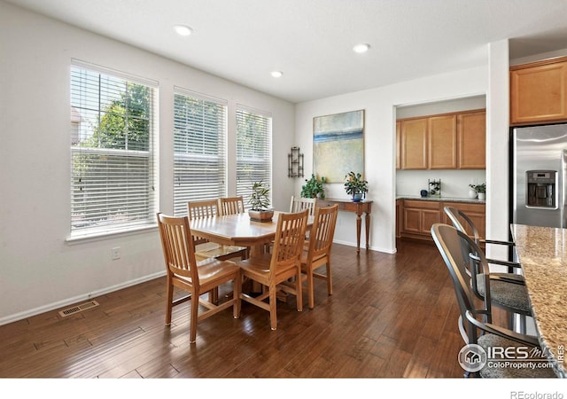 833 Carbonate Ln, Erie, CO 80516 - dining area with dark wood-type flooring and recessed lighting