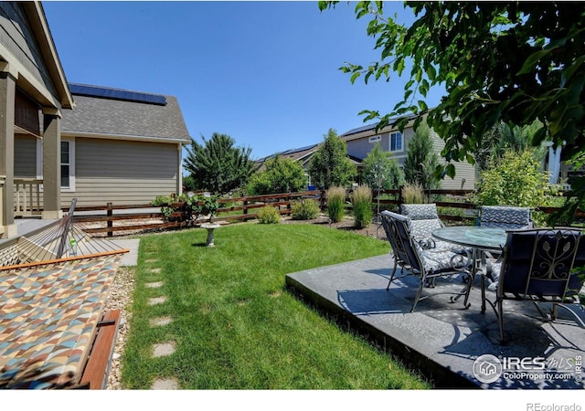 833 Carbonate Ln, Erie, CO 80516 - fenced backyard with a patio area and outdoor dining area