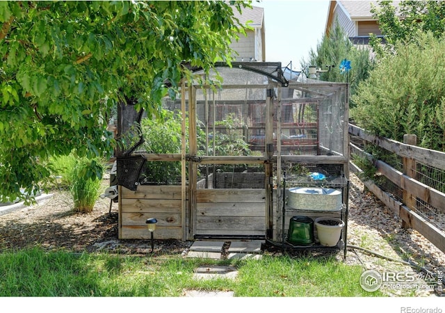 833 Carbonate Ln, Erie, CO 80516 - view of greenhouse featuring a vegetable garden