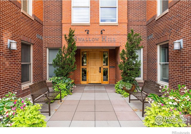 1631 N Emerson St Unit 207, Denver, CO 80218 - view of exterior entry featuring brick siding