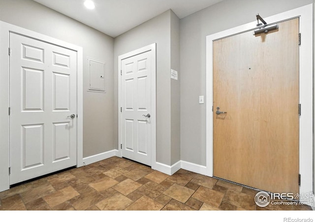 1631 N Emerson St Unit 207, Denver, CO 80218 - entryway featuring stone finish flooring, electric panel, and recessed lighting