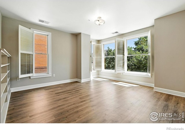 1631 N Emerson St Unit 207, Denver, CO 80218 - spare room with wood finished floors