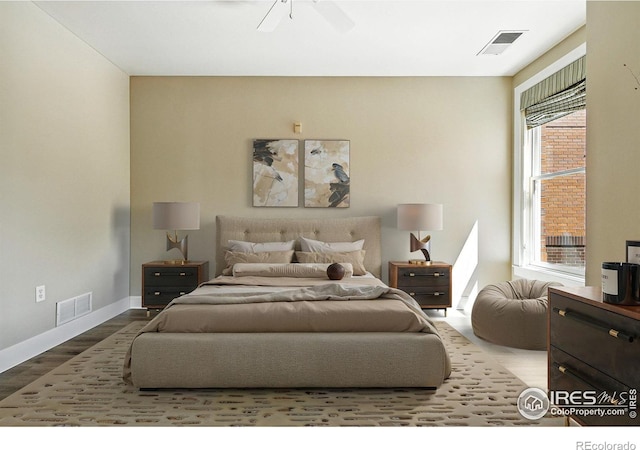 1631 N Emerson St Unit 207, Denver, CO 80218 - bedroom with wood finished floors and ceiling fan