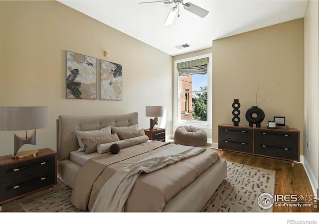 1631 N Emerson St Unit 207, Denver, CO 80218 - bedroom with wood finished floors and a ceiling fan