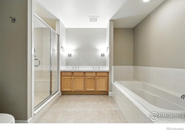 1631 N Emerson St Unit 207, Denver, CO 80218 - full bathroom with a garden tub, a shower stall, tile patterned flooring, and double vanity
