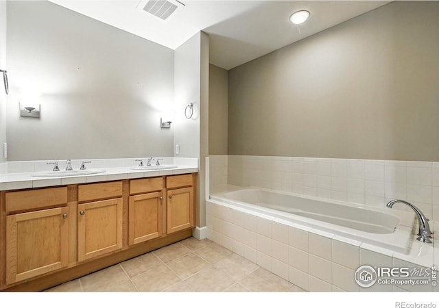 1631 N Emerson St Unit 207, Denver, CO 80218 - bathroom with a garden tub, tile patterned flooring, and double vanity